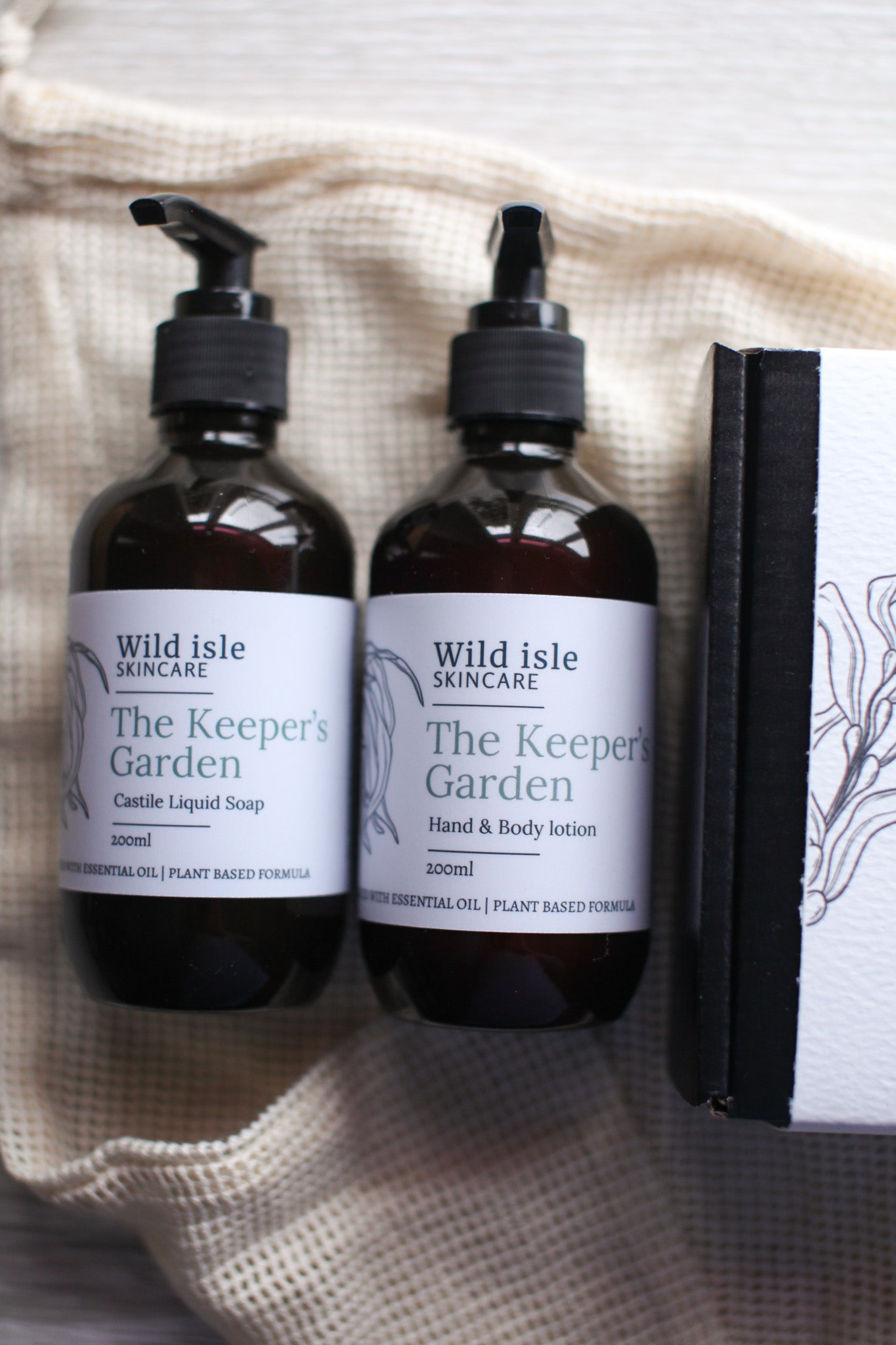Two bottles of Wild Isle Skincare lotion and soap